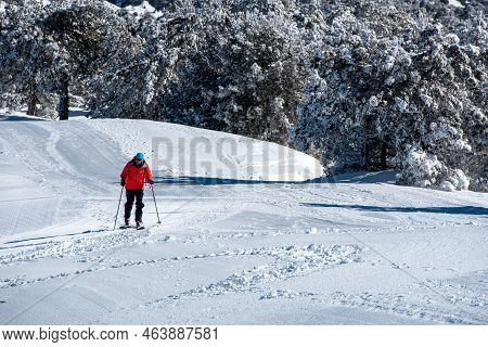 Troodos, Cyprus, January 20 2022: Man Skier Doing Skiing At Snow In Winter. Outdoor Sport Activities