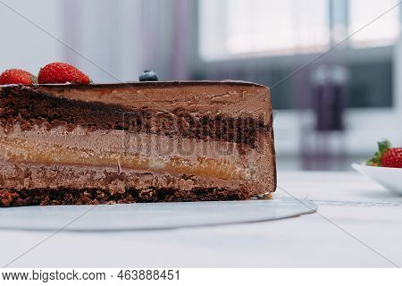 A Piece Of Chocolate Cake In The Cut. Preparation Of Mousse Cake At A Culinary Master Class. Cooking
