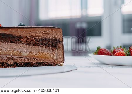 A Piece Of Chocolate Cake In The Cut. Preparation Of Mousse Cake At A Culinary Master Class. Cooking