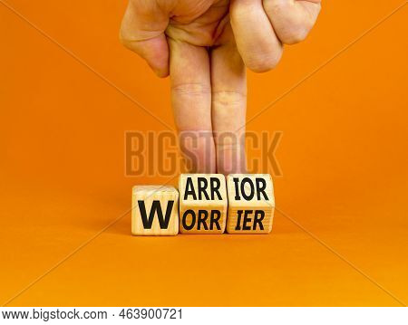 Be Warrior Not Worrier Symbol. Concept Words Warrior And Worrier On Wooden Cubes. Businessman Hand. 