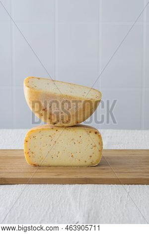Cutted Round Partmesan Or Pecorino Cheese Head On Wooden Board On Light Background. Fresh Dairy Prod