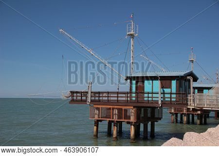 Italy, Marche, Fano: Wooden Constructions On The Water, Called Trabucchi.