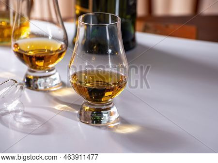 Tasting Of Whiskey, Tulip-shaped Tasting Glasses With Dram Of Scotch Single Malt Or Blended Whisky O