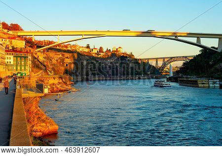 Infante Dom Henrique Bridge In Sunset Light, Porto Cityscape With Embankment By Douro River, Porto, 