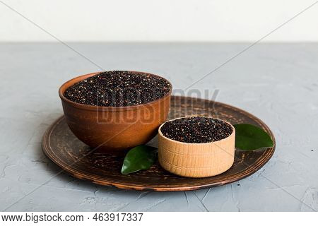 Quinoa Seeds In Bowl On Colored Background. Healthy Kinwa In Small Bowl. Healthy Superfood.