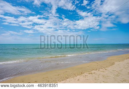 Blue Cloudy Sky And Calm Blue Waters Of Beautiful Hervey Bay On A Sunny Day At Pialba On The Sandy B