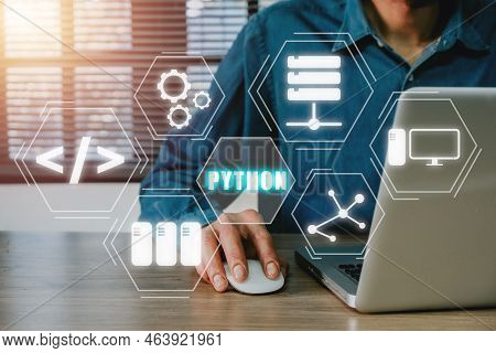 Python Programming Language,man Using Laptop Computer With Python Programming Icon On Virtual Screen