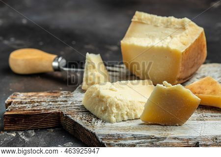 Traditional Gravyer Gruyere Cheese Hard Yellow Cheese Without Holes, With A Dark Crust And A Pleasan
