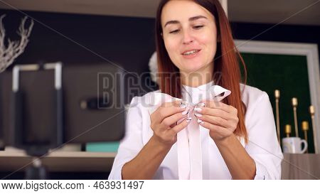 Designer Packing A Gift. Attractive Woman Decorator Conducts Training Online, Videoconference., Reco