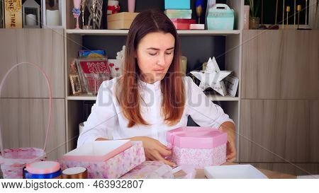 Gifts Wrapping. Attractive Woman, Designer Of Gifts And Decorations Shows Training Online, Records V