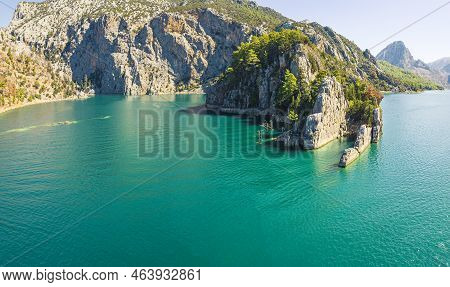 Drone Panoramic View Of Oymapinar Dam Lake, Water Reservoir. Huge Mountain Cliffs Around, And Curvy 