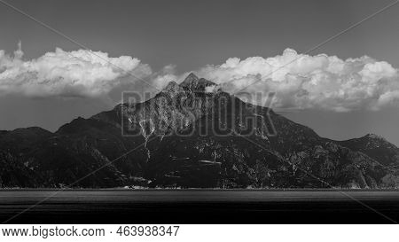 Black And White Picture Made From The Western Coast Of Singitic Gulf, Prominent Dark Mount Athos And