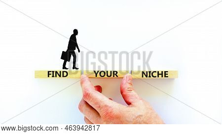 Find Your Niche Symbol. Concept Words Find Your Niche On Wooden Blocks. Businessman Hand. Beautiful 