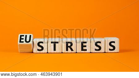 Eustress Or Stress Symbol. Turned The Wooden Cube And Changed The Concept Word Eustress To Stress. B