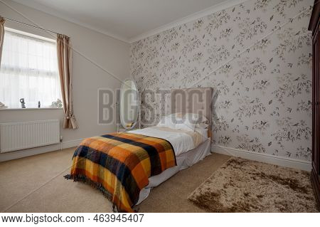 Stradishall, Suffolk, England - June 1 2017 Furnished Bedroom With Feature Wall And Brightly Coloure