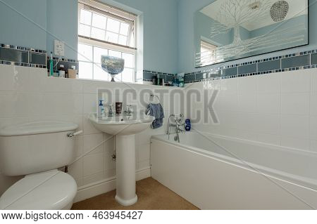 Stradishall, Suffolk, England - June 1 2017 Partially Tiled Bathroom Wc And Hand Basin