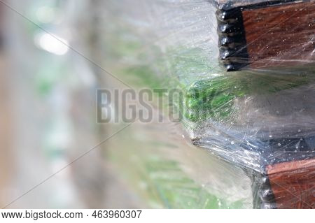 Selective Focus On Cellophane Shrink Wrap On Pallets Of Goods For Transport.