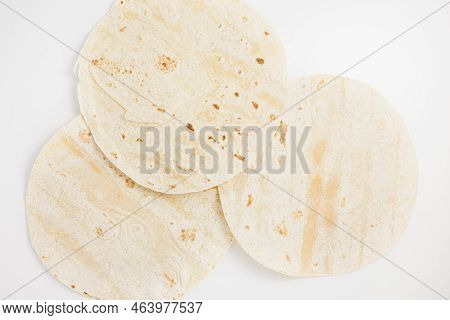 Plain Wheat Tortilla Wraps. Spanish Or Mexican Circular Unleavened Flatbread From Wheat Flour. Ingre