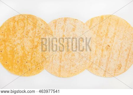 Tomato Flavored Wheat Tortilla Wraps. Spanish Or Mexican Circular Unleavened Flatbread From Wheat Fl