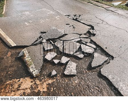 Decayed Road Paved Asphalt Distressed Road Surface With Damaged, Peeling Damaged Road Waiting For Ro