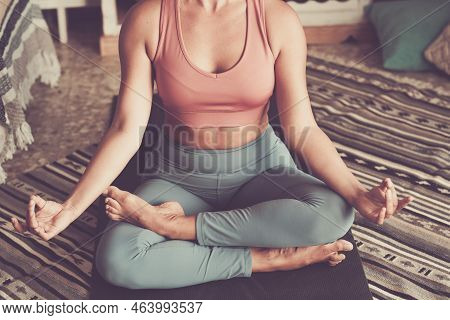 Yoga And Meditation Posture Lifestyle With Young Woman Unrecognizable Doing Lotus Position On A Yoga