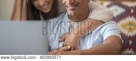 Banner Header Image With Young Couple Using Laptop Together At Home. Boy And Girl Surfing The Web An
