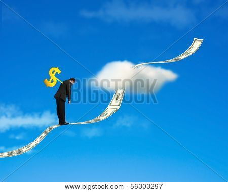 Winder On Businessman's Back With Money Trend And Sky Backgound