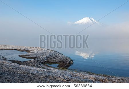 Reflection of Mountain Fuji fujisan with mist at yamanaka lake 