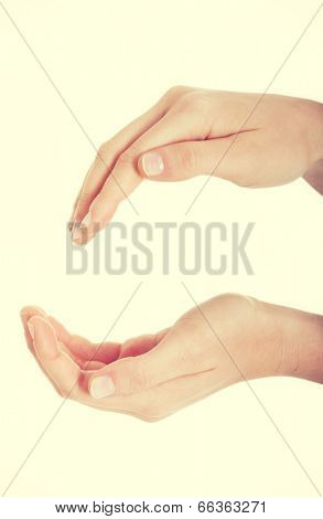 Female's hands in a roung shape.