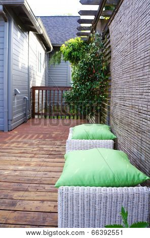 White Wicker Ottomans On Walkout Deck