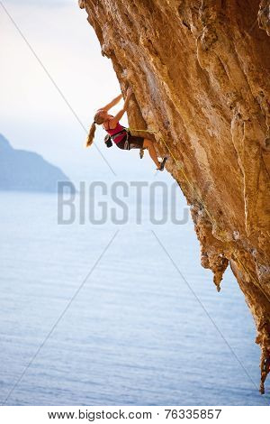 Family rock climber at sunset.