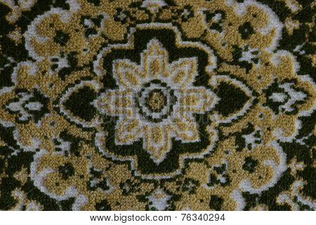 Whirly ornament on a carpet