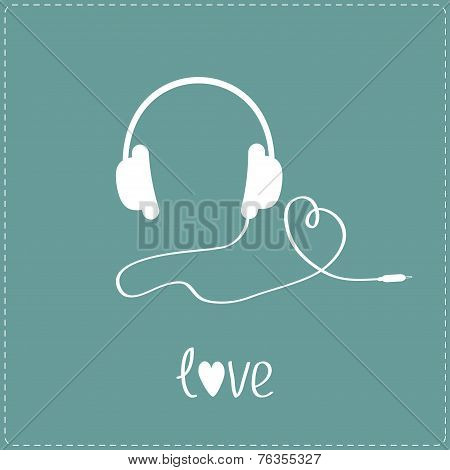 White Headphones And Cord In Shape Of Heart.  Blue Background.