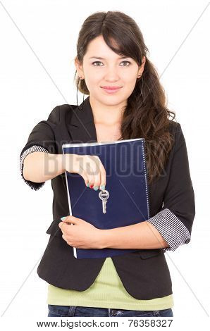 portrait of beautiful woman real estate agent holding a key