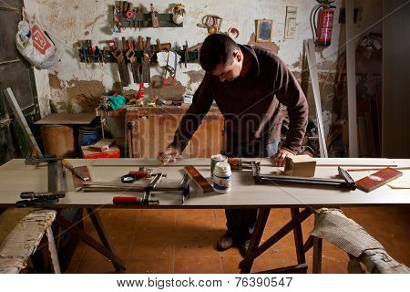 Carpenter Cleaning The Glue