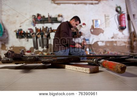 Carpenter Carving An Assembly Hole