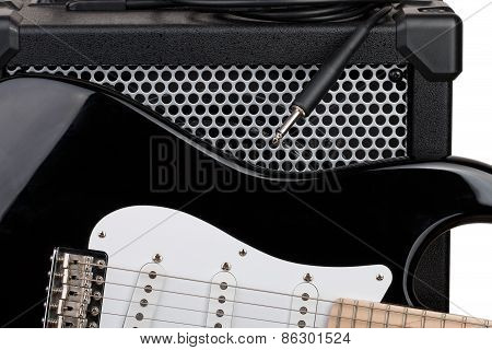 Guitar With Amplifier And Audio Cord With Jack Closeup