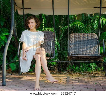 Woman sitting on the swingset