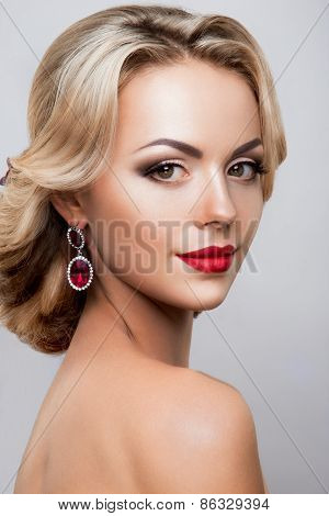 Glamour portrait of beautiful woman model with fresh daily makeup and romantic wavy hairstyle.