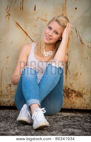 Young Blonde Caucasian Girl Alone On A Street