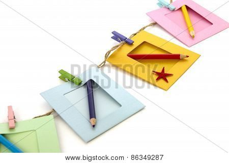 Photo Frame With Pencil Isolated Over White
