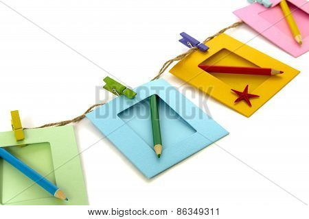 Photo Frame With Pencil Isolated Over White