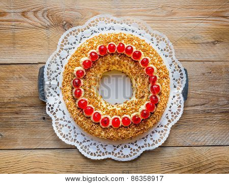 Frankfurter Kranz With Cherries On Rustic Wood