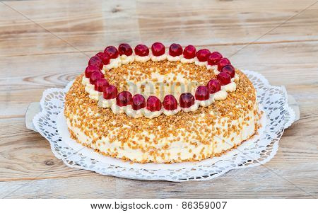 Frankfurter Kranz With Cherries On Rustic Wood