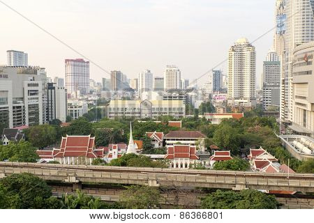 Bangkok,thailand-february 17:bangkok Mass Transit System (bts) Pass The Pathumwanaram Temple At Siam