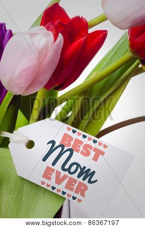 best mom ever against tulips with note
