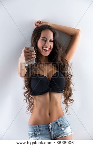 Image of playful busty woman doing selfie