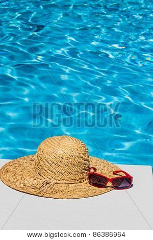 utensils for a nice relaxing vacation day lying next to a swimming pool. relaxation on vacation.