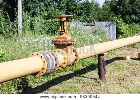 Gas Line In Village In Summer Day