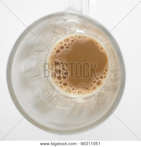 Top view of lnearly empth glass with little Tea with milk or Teh Tarik in Malaysia